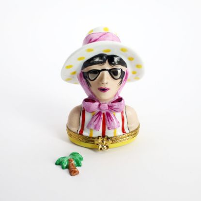 Picture of  Retired Limoges Porcelain Vacationing Lady Trinket Box with Surprise Palm Tree Inside. 