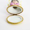 Picture of  Retired Limoges Porcelain Vacationing Lady Trinket Box with Surprise Palm Tree Inside. 
