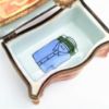 Picture of Retired Limoges Porcelain Dresser with Hat & Book Trinket Box