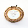 Picture of  Retired Limoges Porcelain Tabby Cat with Pink Bow in Basket Trinket Box