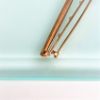Picture of Edwardian Era Pair Of 14K Yellow Gold, Seed Pearl & White Enamel Bar Brooches